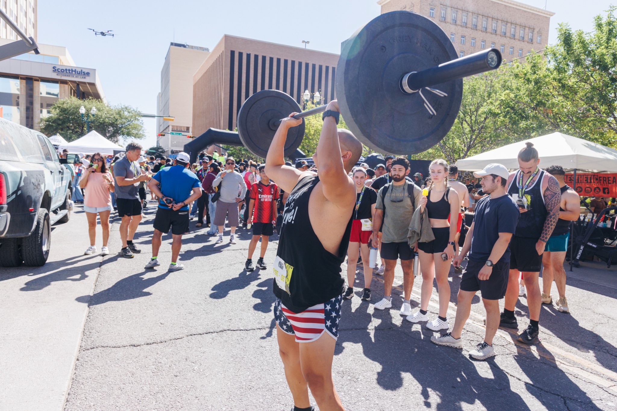 Athlete lifting a weighted bar during the Badass Human Race